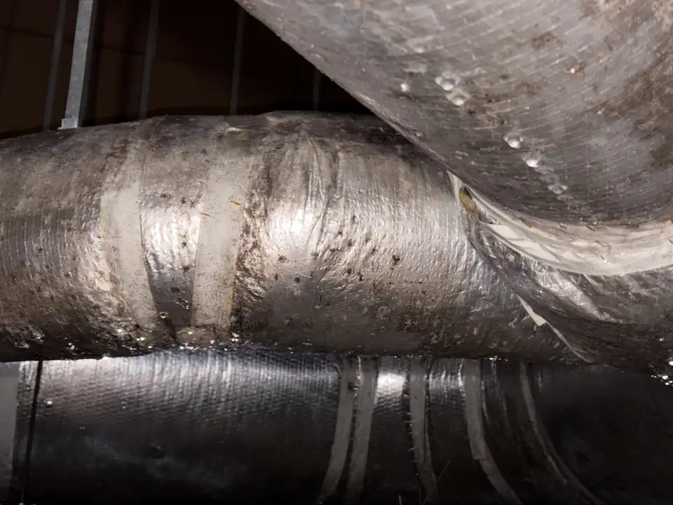 Insulated duct sweating from humidity during a New Orleans AC service